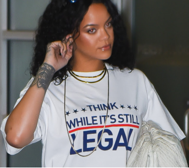 THINK WHILE IT'S STILL LEGAL shirt as worn by Rihanna leaving Chelsea Pier 59 Studio in Manhattan on September 24, 2021 in New York City. PYGear.com